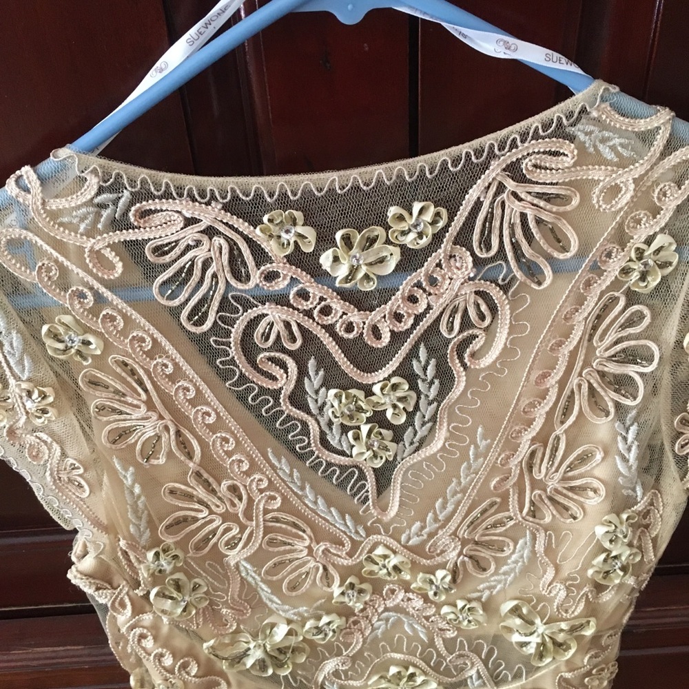 Short lacy dress very fancy.